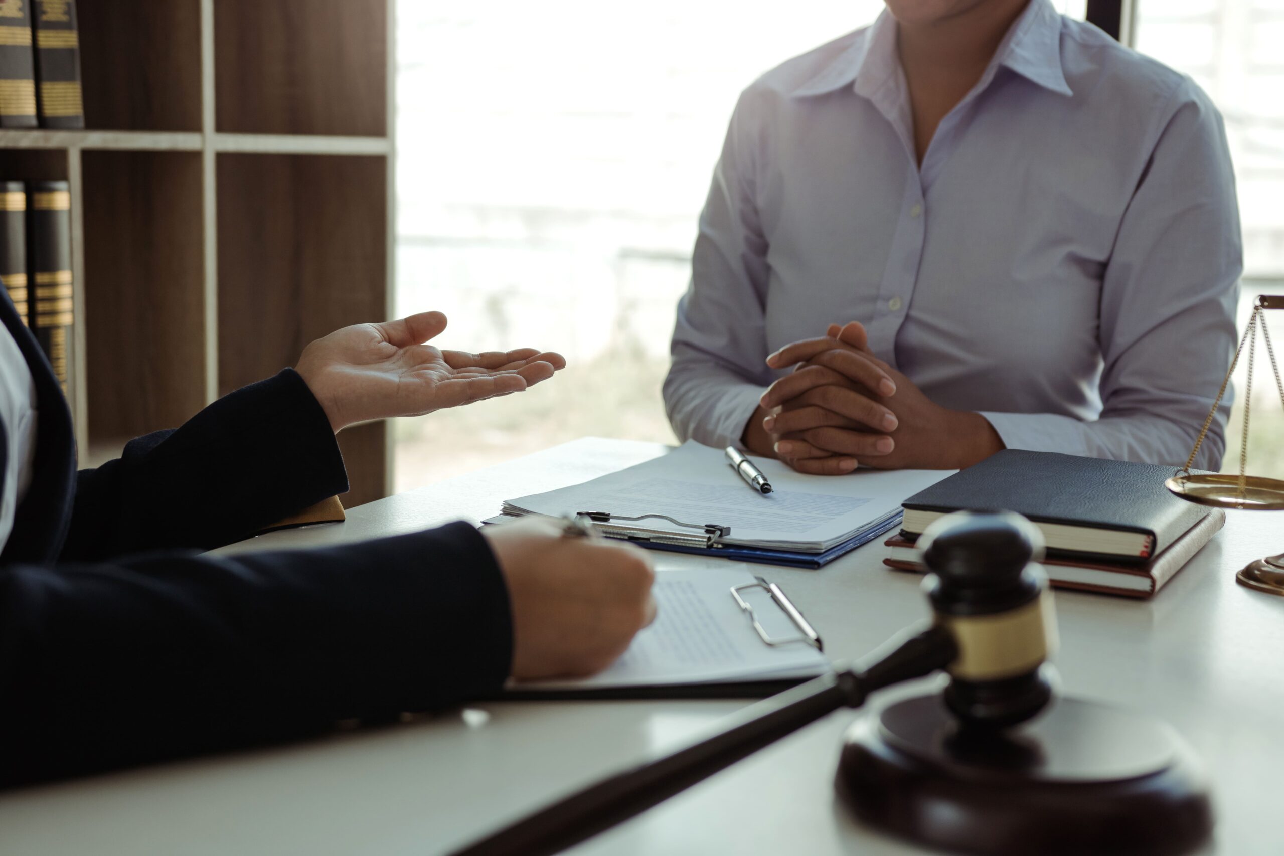 Lawyer giving advice to clients about their personal injury case.